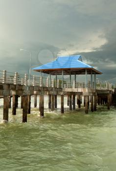 pier on piles against overcast sky
