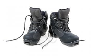 A pair of cross country ski boots isolated on white background