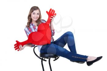 Beautiful girl with A red plush heart, isolate on white