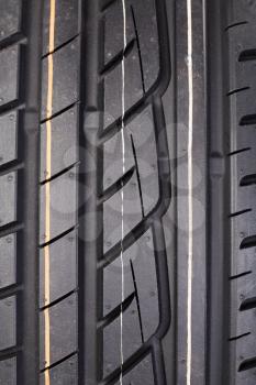 Close-up image or new vehicle tire tread pattern