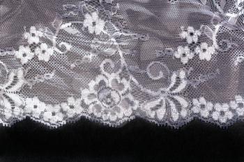 openwork lace satin isolated on a black background