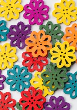 Colorful abstract background of bright objects in the form of flowers on a light background