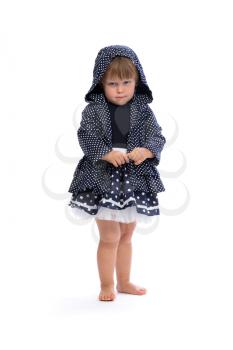 Little girl angry in the hood with polka dots. Isolate on white.