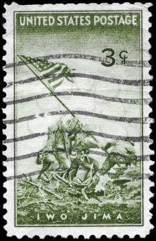 Royalty Free Photo of a 1945 US Stamp of the Marines Raising the Flag at Iwo Jima, from a Photograph by Joel Rosenthal