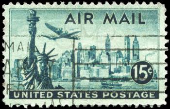 Royalty Free Photo of a 1947 US Stamp of Statue of Liberty and New York Skyline