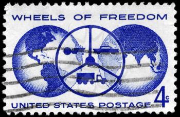 Royalty Free Photo of 1960 US Stamp Shows the Globe and Steering Wheel With Tractor, Car and Truck, Inscribed Wheels of Freedom