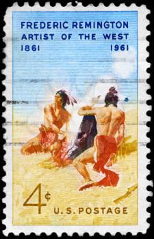 Royalty Free Photo of 1961 US Stamp Shows Smoke Signal by Western Artist Frederic Remington (1861-1909)