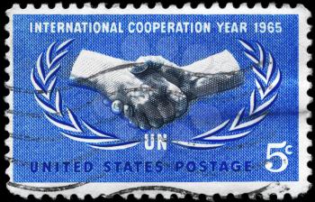 Royalty Free Photo of 1965 US Stamp Shows the International Cooperation Year Issue, and UN's 20th Anniversary