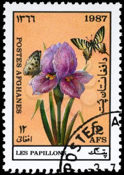 AFGHANISTAN - CIRCA 1987: A Stamp printed in AFGHANISTAN shows image of a Butterflies by Flower, series, circa 1987