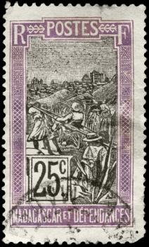 MADAGASCAR - CIRCA 1922: A Stamp printed in MADAGASCAR shows the Transportation by Sedan Chair, circa 1922