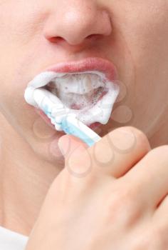 Royalty Free Photo of a Person Brushing Their Teeth