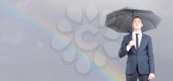 Royalty Free Photo of a Man Holding an Umbrella 