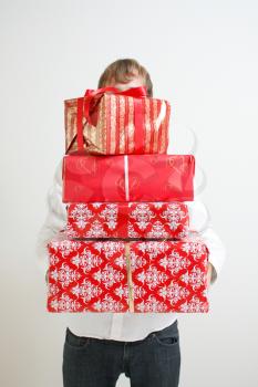 Royalty Free Photo of a Man Holding Presents