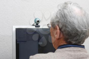 Royalty Free Photo of an Elderly Man Using a Computer