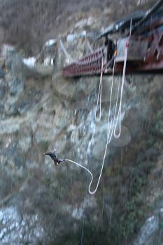 Royalty Free Photo of a Man Bungee Jumping in New Zealand