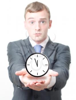 Royalty Free Photo of a Businessman Holding a Clock