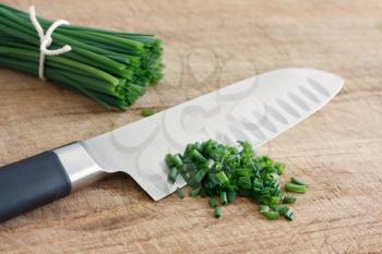 Royalty Free Photo of Chives on a Cutting Board