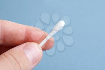 Royalty Free Photo of a Person Holding a Cotton Swab