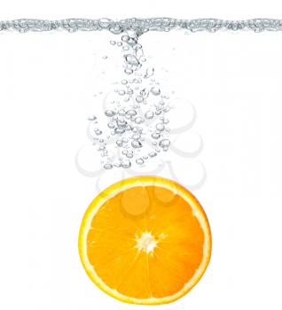 Royalty Free Photo of an Orange in Water