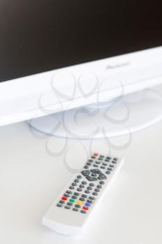 Royalty Free Photo of a Television and Remote Controller