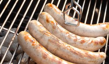 Royalty Free Photo of Sausage on a Barbecue