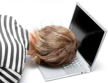 Royalty Free Photo of a Man Sleeping on a Laptop