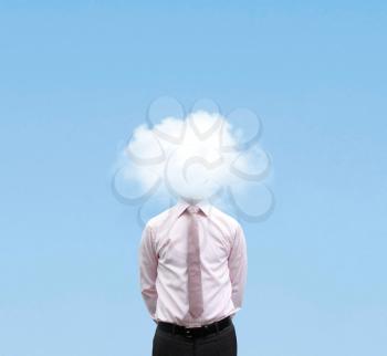 Royalty Free Photo of a Businessman in a Cloud