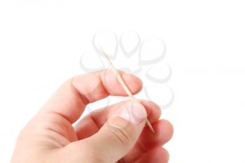 Royalty Free Photo of a Person Holding a Toothpick