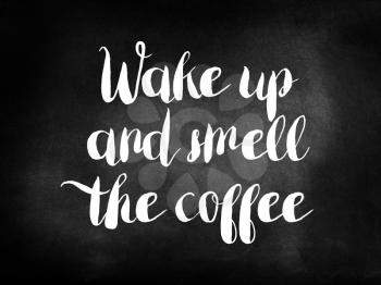 Wake up and smell the coffee written on a chalkboard