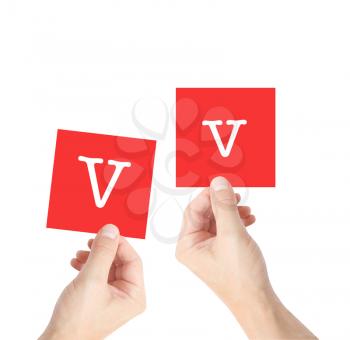 V written on cards held by hands