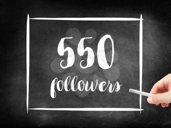 550 followers written on a blackboard