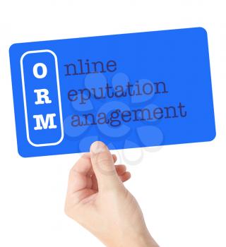 Online Reputation Management explained on a card held by a hand