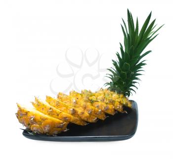 pineapple sliced on a black plate isolated on white background