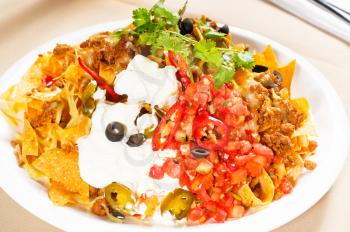 fresh nachos and vegetable salad with meat ,chili con carne  ,tipycal mexican food