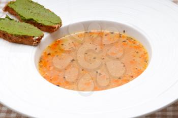 classic Italian minestrone passato soup with pesto crostini on side