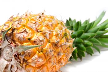 ripe vivid pineapple close up over white background