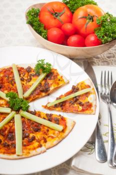 fresh baked Turkish beef pizza with cucumber on top
