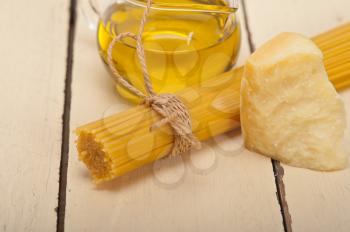 Italian pasta basic food ingredients parmesan cheese and extra virgin olive oil