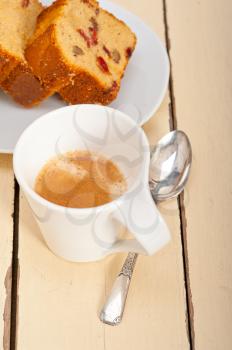 plum cake and espresso coffee over a white rustic table 