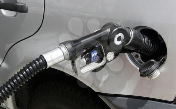 Royalty Free Photo of a Car Fueling Up