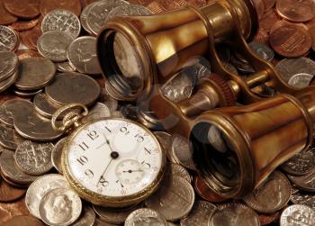 Royalty Free Photo of a Pocket Watch and Opera Glasses on Coins