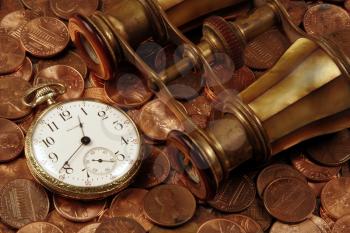 Royalty Free Photo of a Pocket Watch and Coins