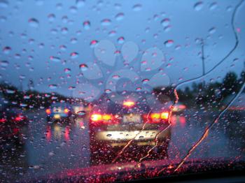 Royalty Free Photo of Cars Driving in the Rain