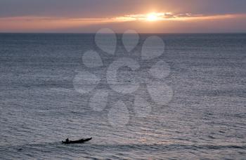 Royalty Free Photo of a Canoe in the Ocean