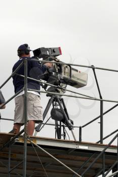 Royalty Free Photo of a TV Camera Crew Working On Scaffolding