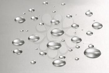 Royalty Free Photo of Water Drops on a Metal Background