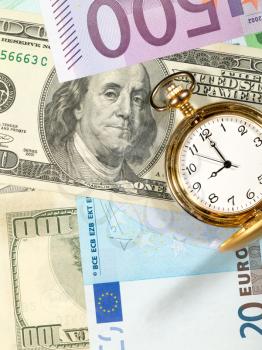 Royalty Free Photo of a Banknote Background With a Watch