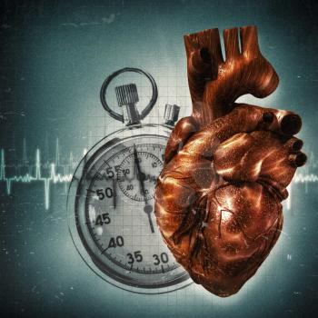 Royalty Free Photo of a Heart and Stopwatch