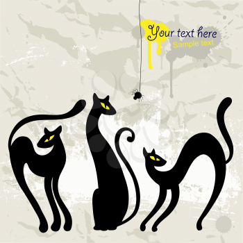 Royalty Free Clipart Image of Three Cats and a Spider