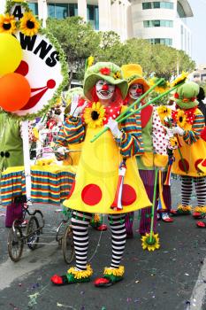 Royalty Free Photo of People Dressed as Clowns in a Parade